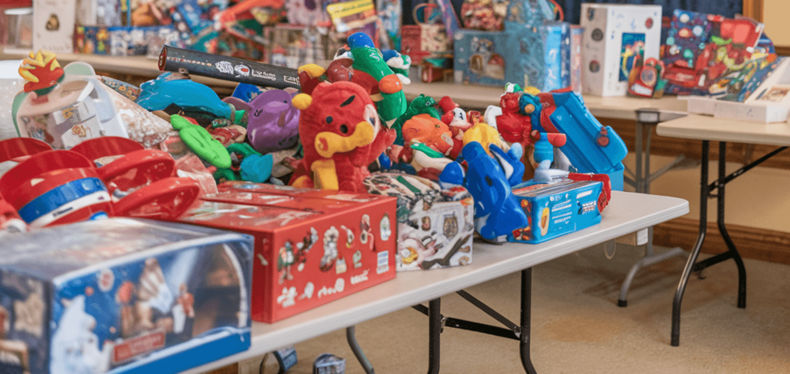 Collection of colorful toys and gifts for the Ruth's Retreat House Toy Drive